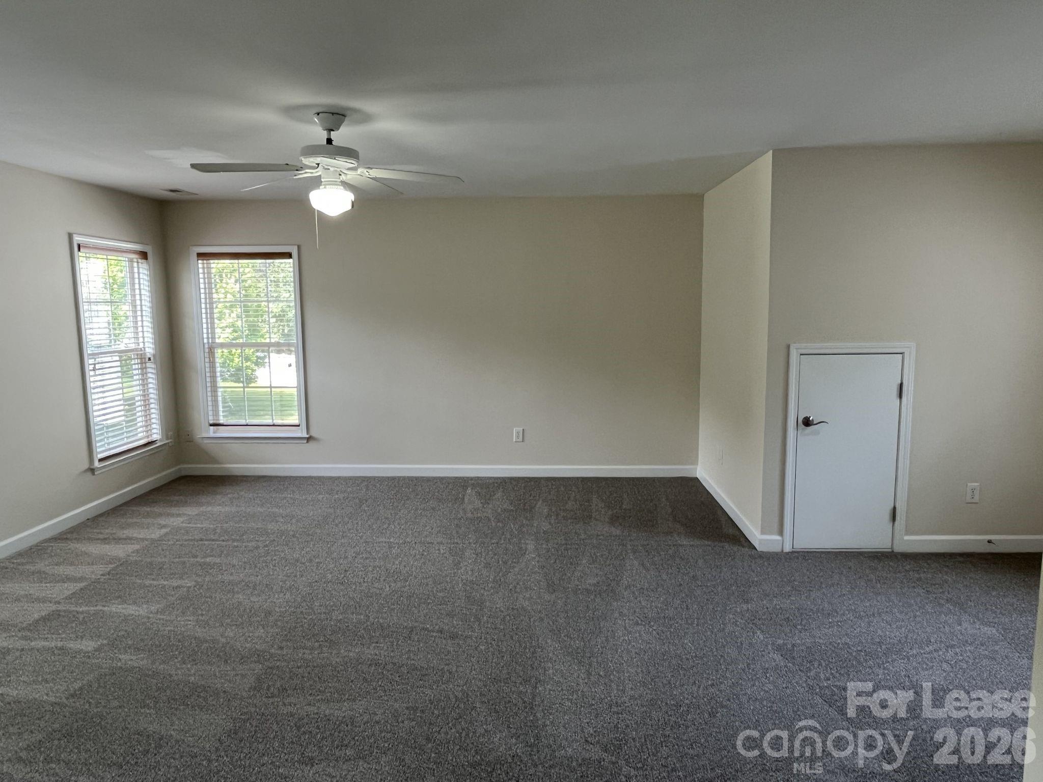 8531 Camberly Road Huntersville, NC 28078 - Photo 25 of 32 a view of an empty room with a window