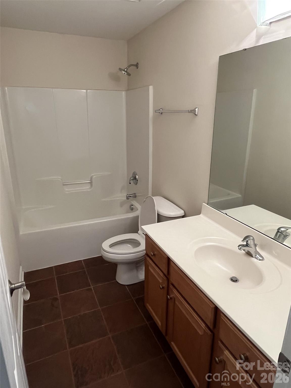 8531 Camberly Road Huntersville, NC 28078 - Photo 27 of 32 a bathroom with a sink a toilet and shower