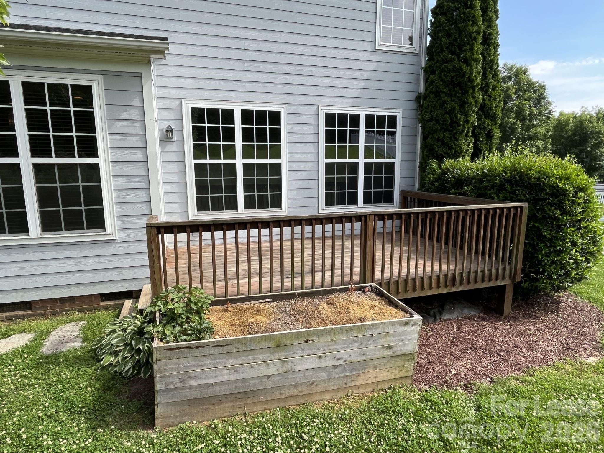 8531 Camberly Road Huntersville, NC 28078 - Photo 28 of 32 a side view of a house with a deck
