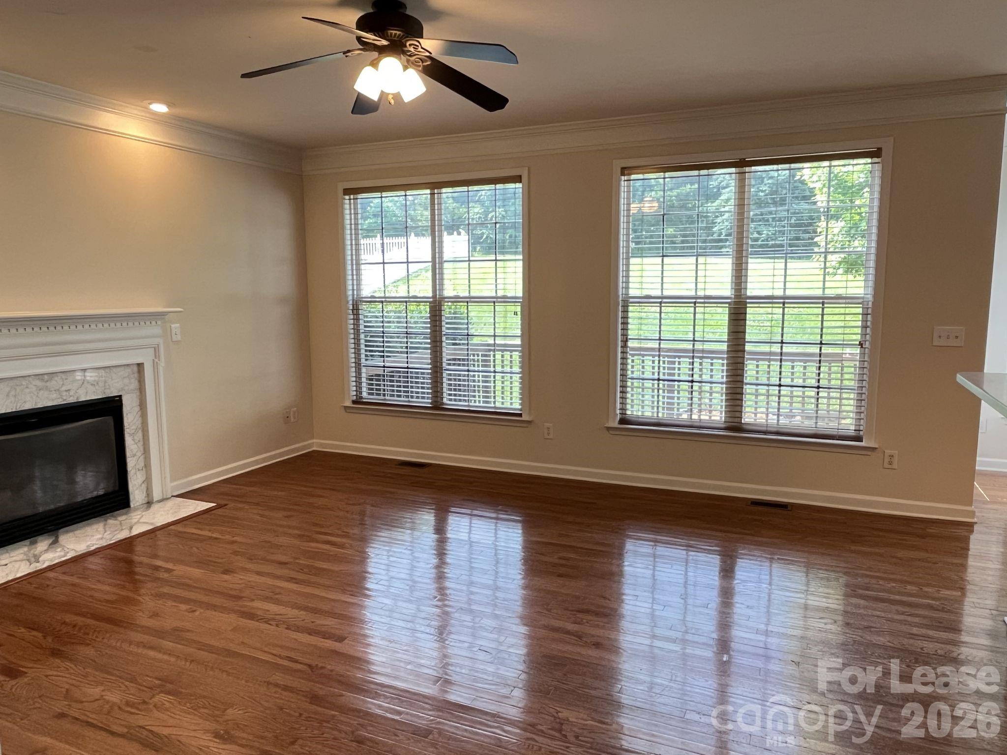 8531 Camberly Road Huntersville, NC 28078 - Photo 7 of 32 a view of an empty room with wooden floor and a window