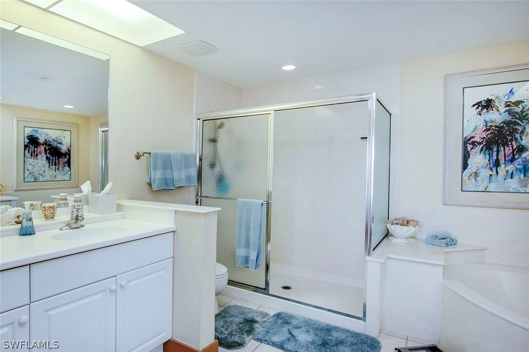 1251 South Seas Plantation Road Captiva, FL 33924 - Photo 11 of 24 a bathroom with a sink a mirror a vanity and shower