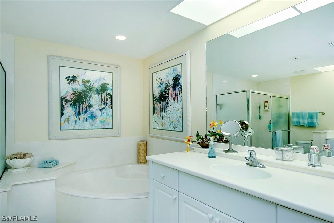 1251 South Seas Plantation Road Captiva, FL 33924 - Photo 12 of 24 a bathroom with a bathtub sink and mirror