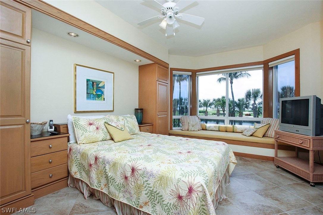 1251 South Seas Plantation Road Captiva, FL 33924 - Photo 14 of 24 a bedroom with a bed and a flat screen tv