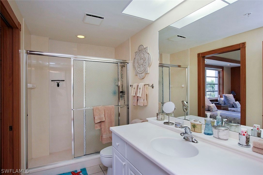 1251 South Seas Plantation Road Captiva, FL 33924 - Photo 16 of 24 a bathroom with a sink toilet and shower