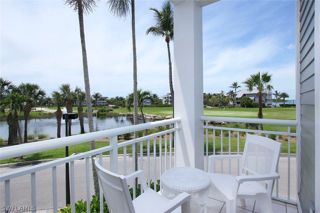 1251 South Seas Plantation Road Captiva, FL 33924 - Photo 19 of 24 a view of roof deck with a chair and floor to ceiling window