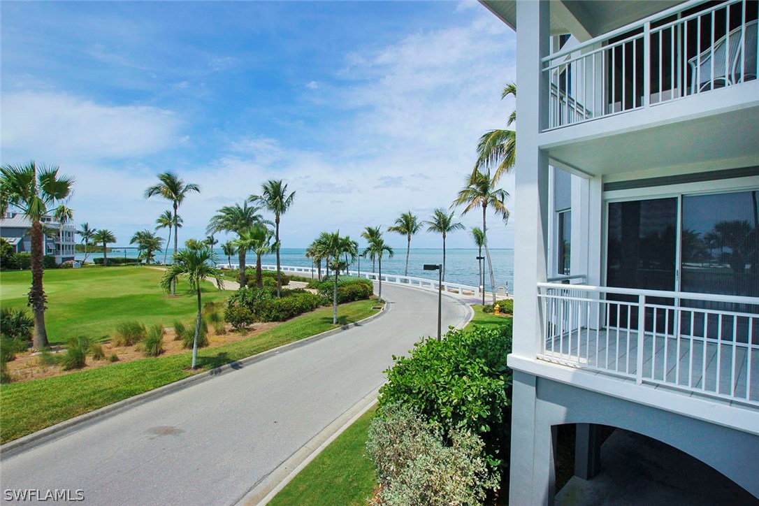 1251 South Seas Plantation Road Captiva, FL 33924 - Photo 20 of 24 a view of a house with a yard and potted plants