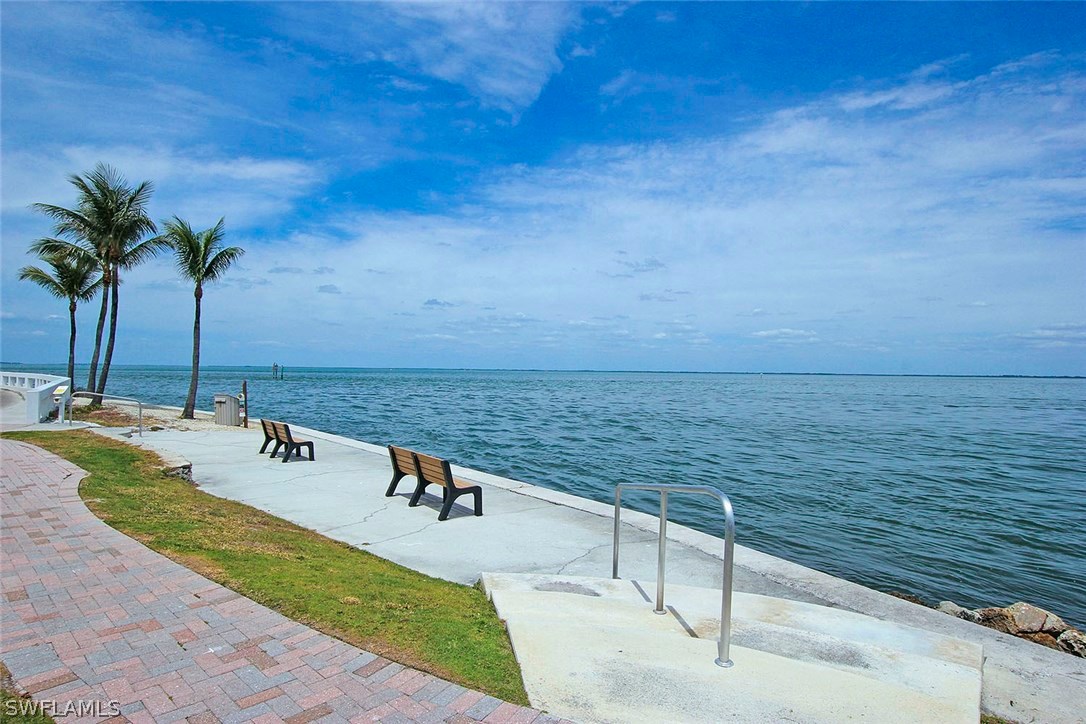 1251 South Seas Plantation Road Captiva, FL 33924 - Photo 23 of 24 a view of swimming pool with a table and chairs