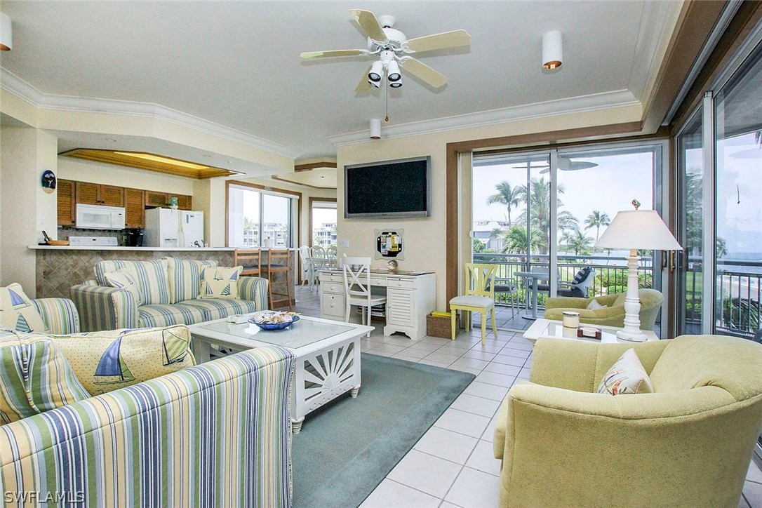 1251 South Seas Plantation Road Captiva, FL 33924 - Photo 4 of 24 a living room with furniture and a flat screen tv