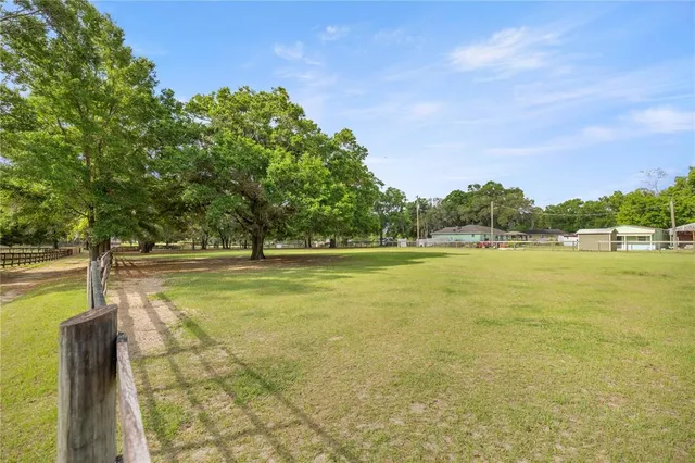 a view of a swimming pool with an outdoor space and seating area