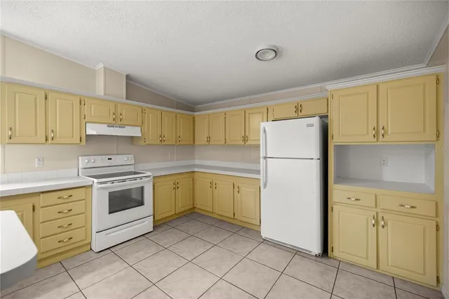 a bathroom with a sink a toilet and a shower