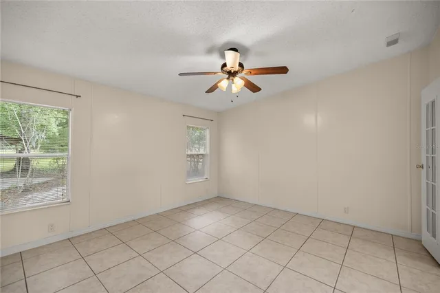 a view of an entryway with a chandelier fan
