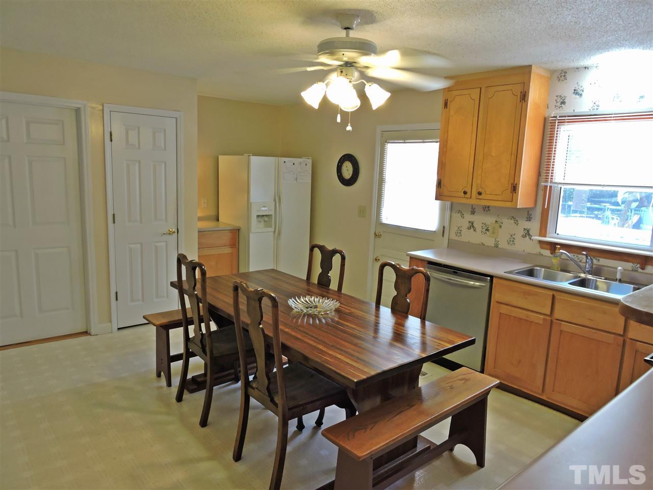 6602 Whitt Road Durham, NC 27712 - Photo 4 of 15 a view of a dining room with furniture and window