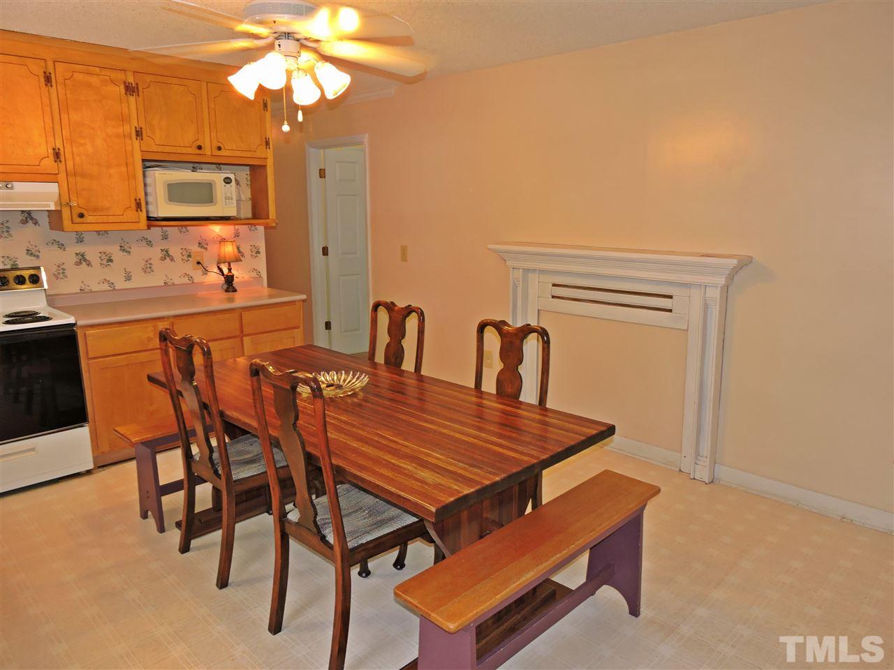 6602 Whitt Road Durham, NC 27712 - Photo 5 of 15 a dining room with furniture and window