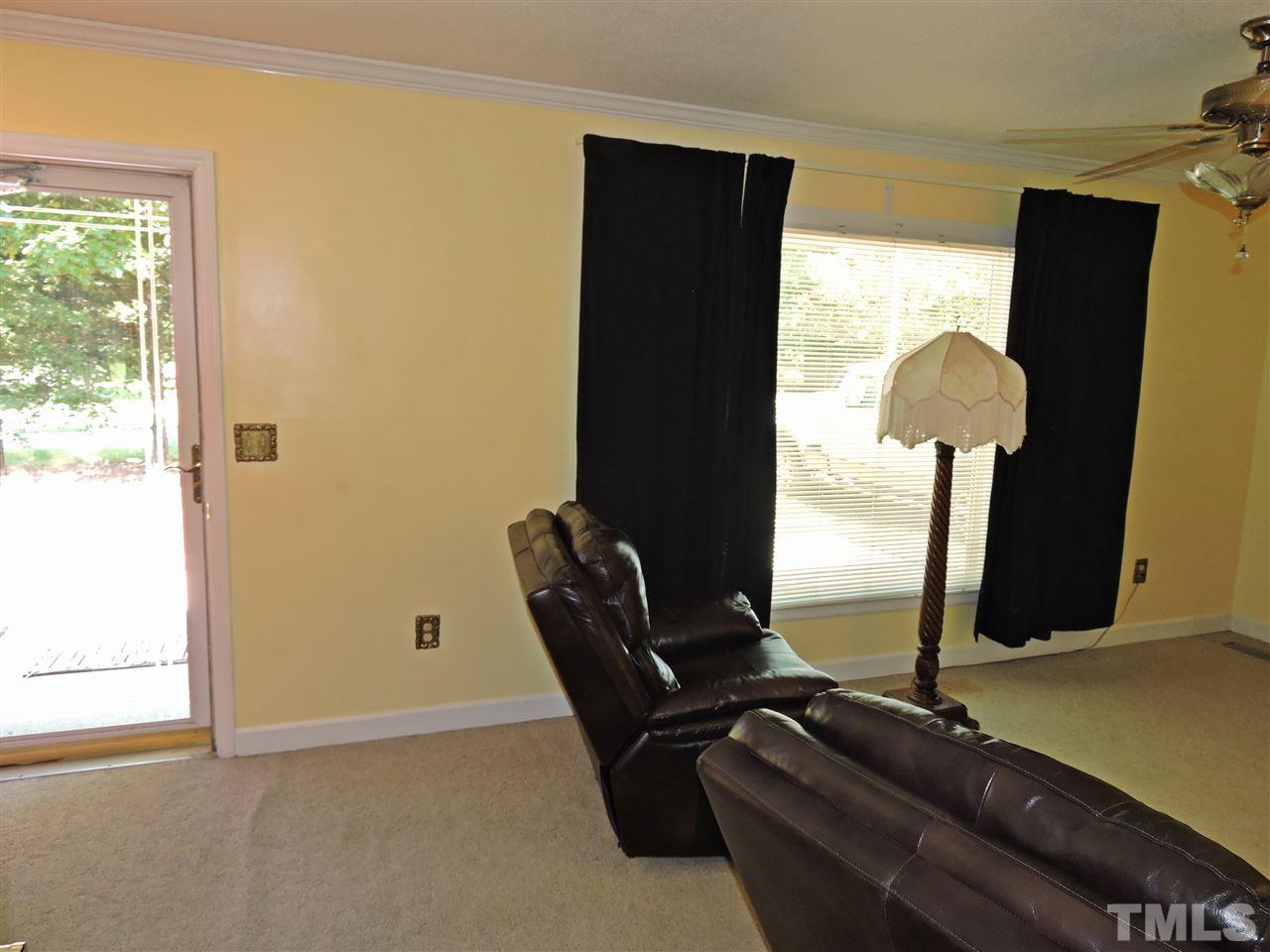 6602 Whitt Road Durham, NC 27712 - Photo 6 of 15 a room with furniture and a window