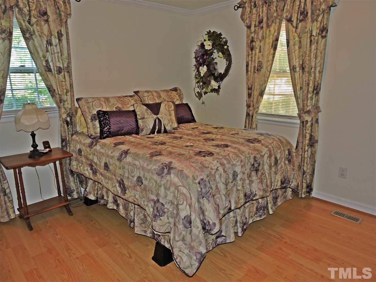 6602 Whitt Road Durham, NC 27712 - Photo 8 of 15 a bedroom with a bed and a window