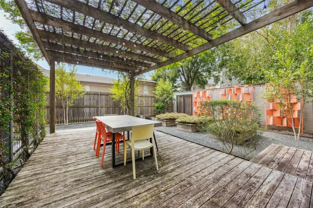 a outdoor view with a sitting space and large windows