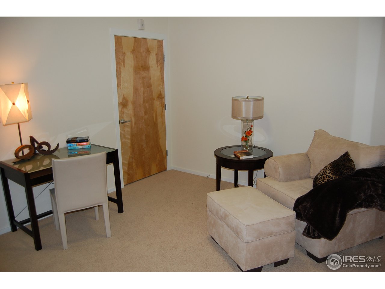 204 Maple Street, Unit 403 Fort Collins, CO 80521 - Photo 11 of 14 a living room with furniture and a mirror