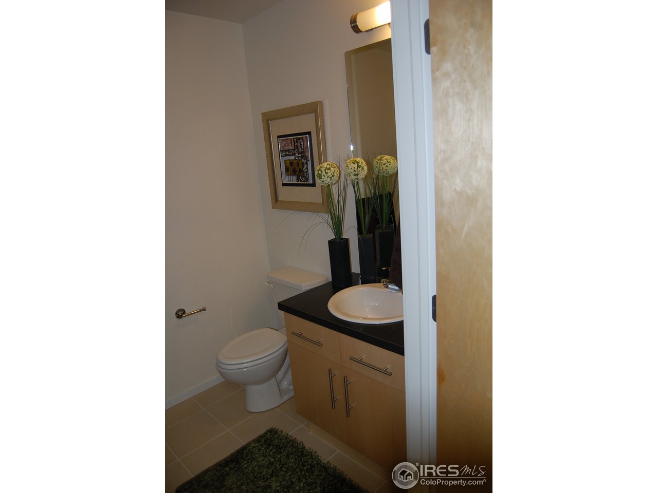 204 Maple Street, Unit 403 Fort Collins, CO 80521 - Photo 13 of 14 a bathroom with a toilet and a sink