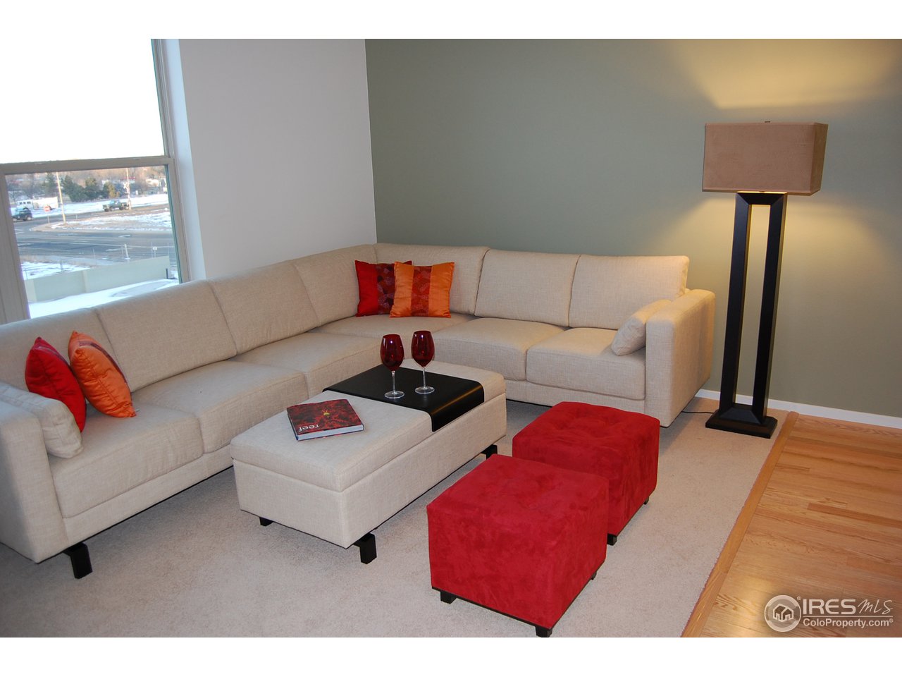 204 Maple Street, Unit 403 Fort Collins, CO 80521 - Photo 2 of 14 a living room with furniture and a lamp
