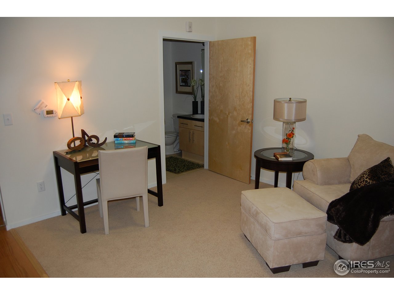 204 Maple Street, Unit 403 Fort Collins, CO 80521 - Photo 10 of 14 a living room with furniture and a lamp