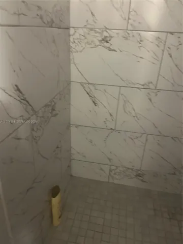 a room with water heater and shelf