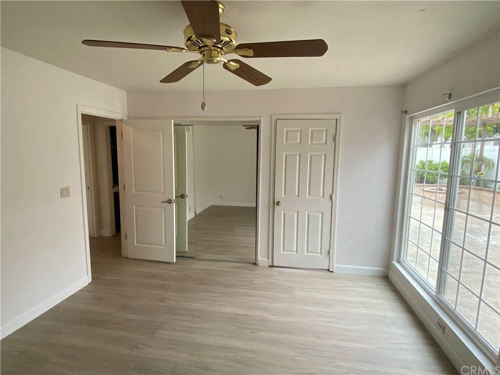 5321 Strasbourg Avenue Irvine, CA 92604 - Photo 11 of 28 a view of empty room with wooden floor and fan
