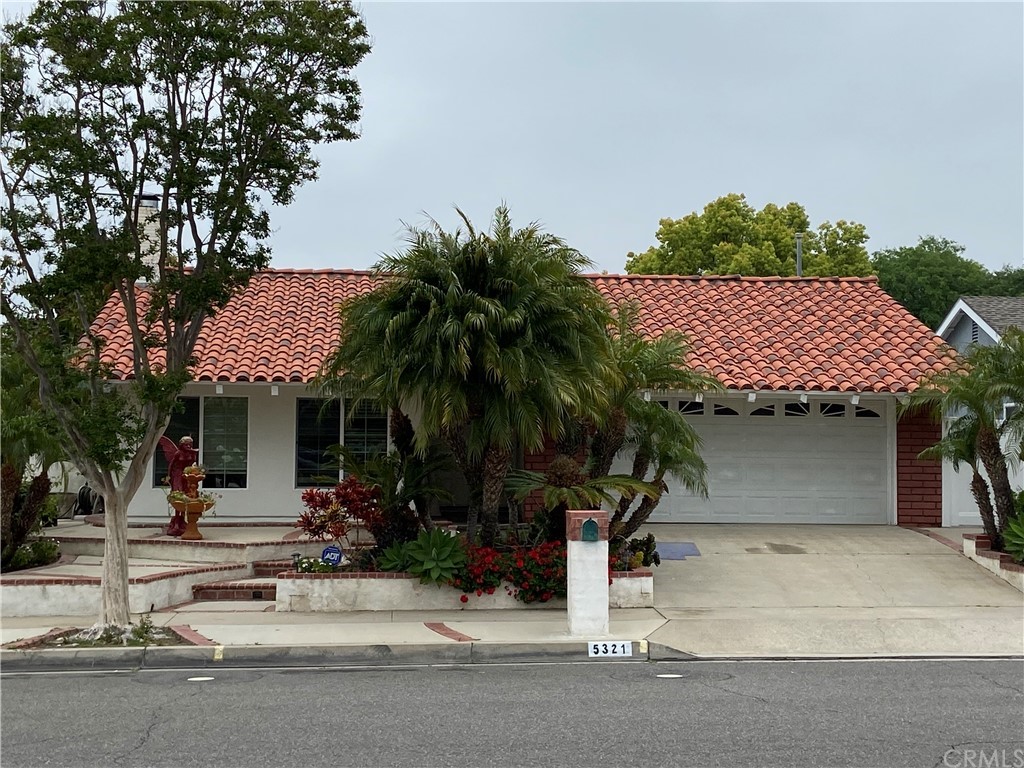 5321 Strasbourg Avenue Irvine, CA 92604 - Photo 2 of 28 front view of a house with a potted plant and palm trees
