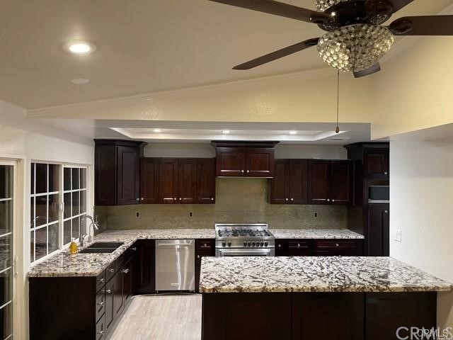5321 Strasbourg Avenue Irvine, CA 92604 - Photo 7 of 28 a kitchen with stainless steel appliances granite countertop a sink stove and cabinets