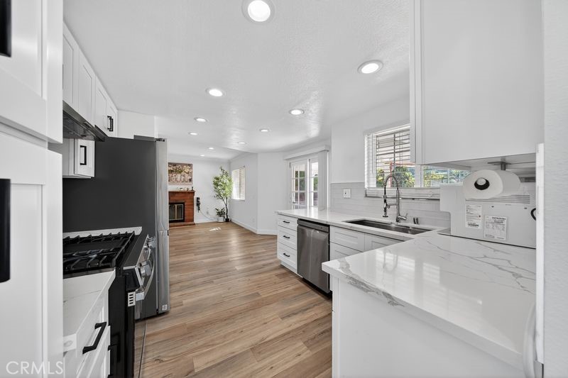 19610 Vega Way Rowland Heights, CA 91748 - Photo 11 of 30 a kitchen with stainless steel appliances granite countertop a sink stove and refrigerator