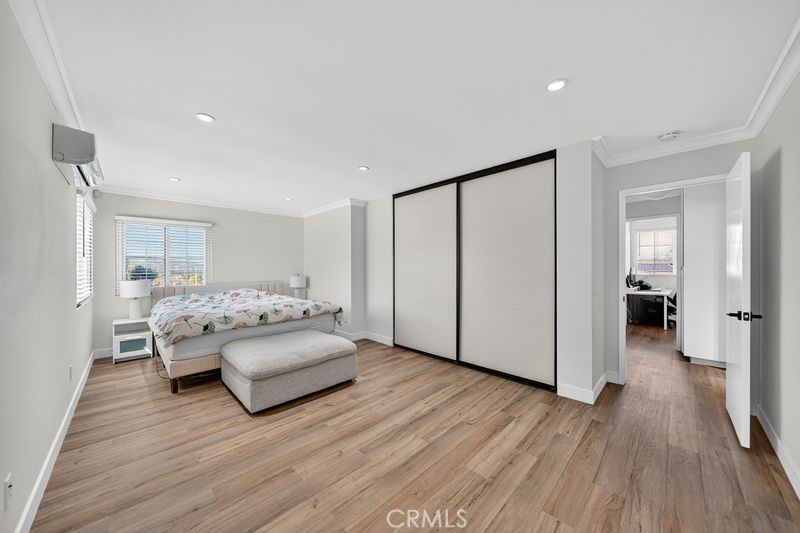 19610 Vega Way Rowland Heights, CA 91748 - Photo 17 of 30 a spacious bedroom with a bed and a wooden floor