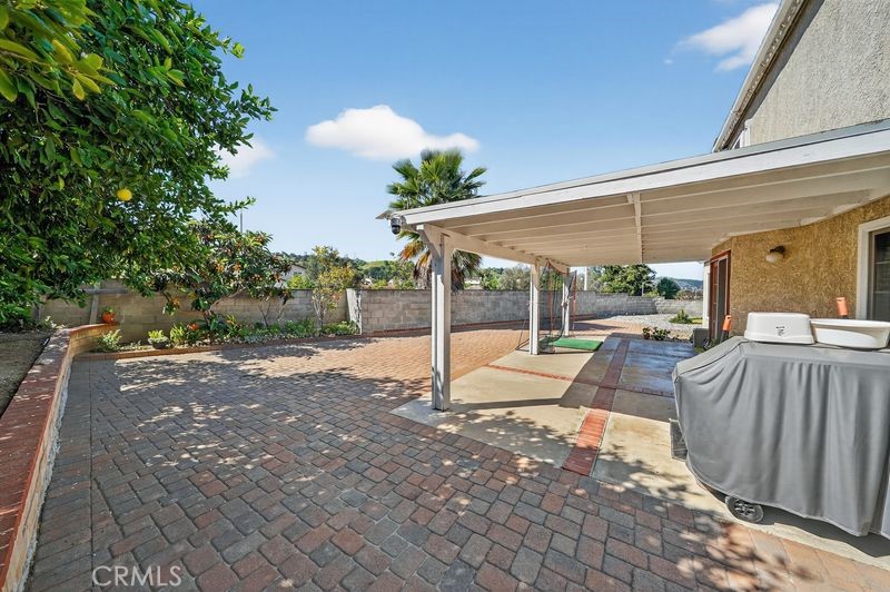 19610 Vega Way Rowland Heights, CA 91748 - Photo 26 of 30 a view of a patio with a table chairs and a backyard
