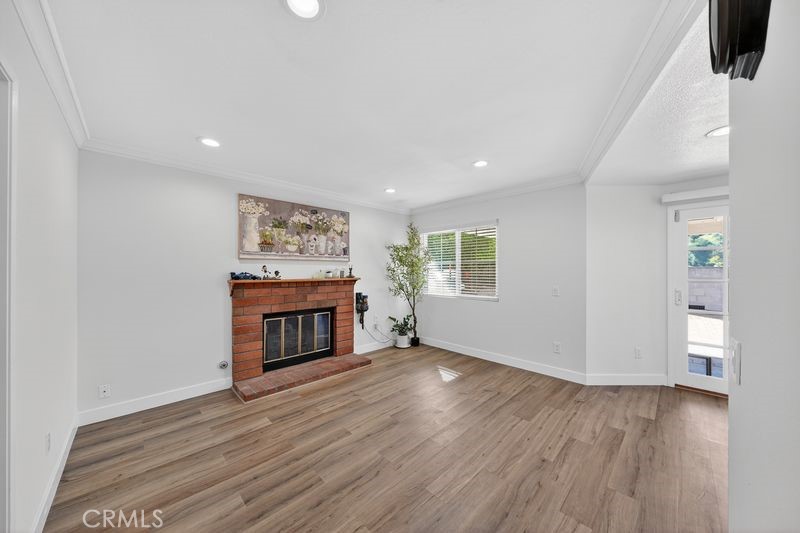19610 Vega Way Rowland Heights, CA 91748 - Photo 9 of 30 wooden floor in an empty room with a fireplace