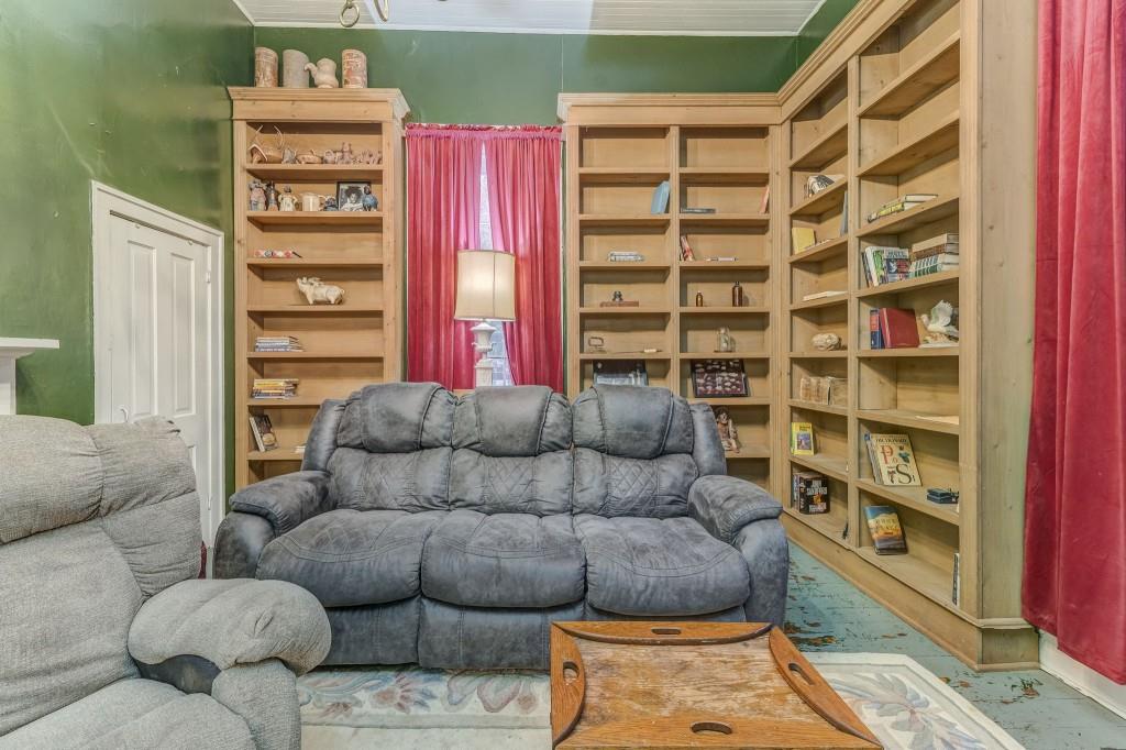 1006 Avenue A Rome, GA 30165 - Photo 18 of 61 a living room with furniture and a book shelf
