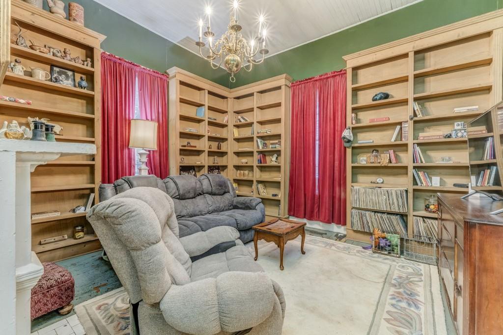 1006 Avenue A Rome, GA 30165 - Photo 19 of 61 a living room with furniture a chandelier and a window