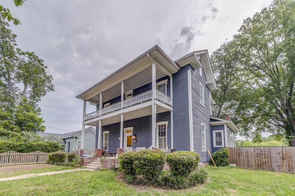 1006 Avenue A Rome, GA 30165 - Photo 2 of 61 a front view of a house with a yard