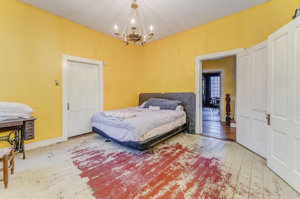 1006 Avenue A Rome, GA 30165 - Photo 23 of 61 a bedroom with a bed and a table in it