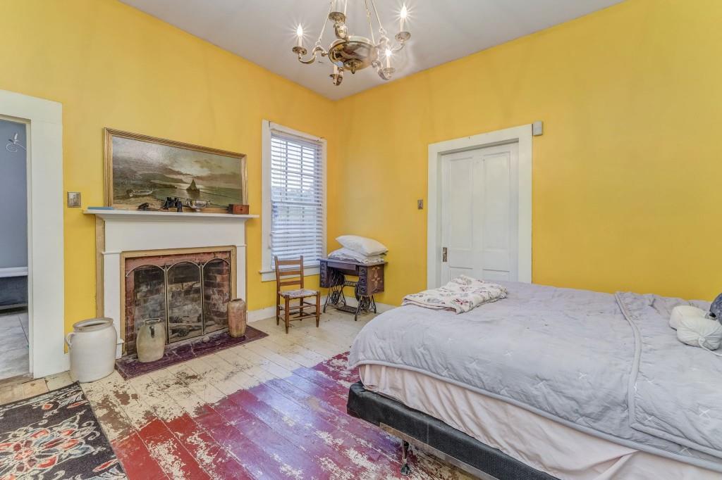1006 Avenue A Rome, GA 30165 - Photo 24 of 61 a bedroom with a bed and a fireplace