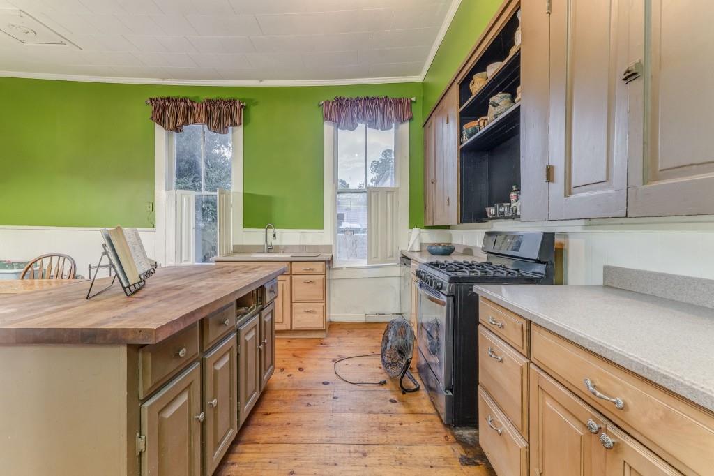 1006 Avenue A Rome, GA 30165 - Photo 28 of 61 a kitchen with stainless steel appliances granite countertop a sink stove and refrigerator