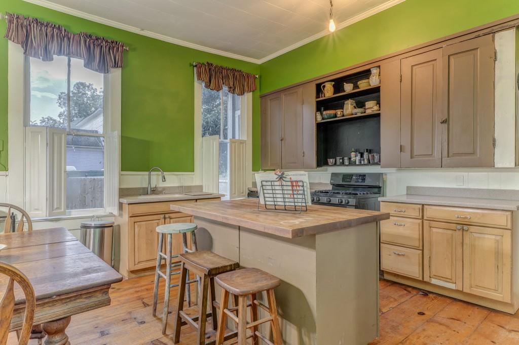 1006 Avenue A Rome, GA 30165 - Photo 29 of 61 a kitchen that has a sink and a stove in it