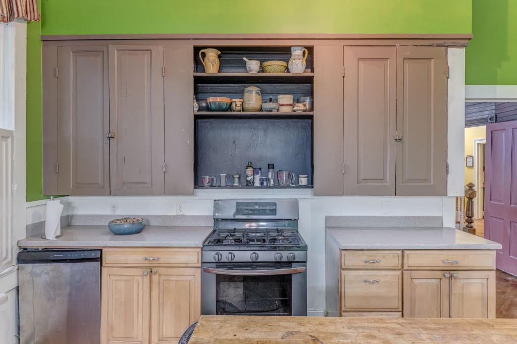1006 Avenue A Rome, GA 30165 - Photo 31 of 61 a kitchen with stainless steel appliances granite countertop a stove and a cabinets