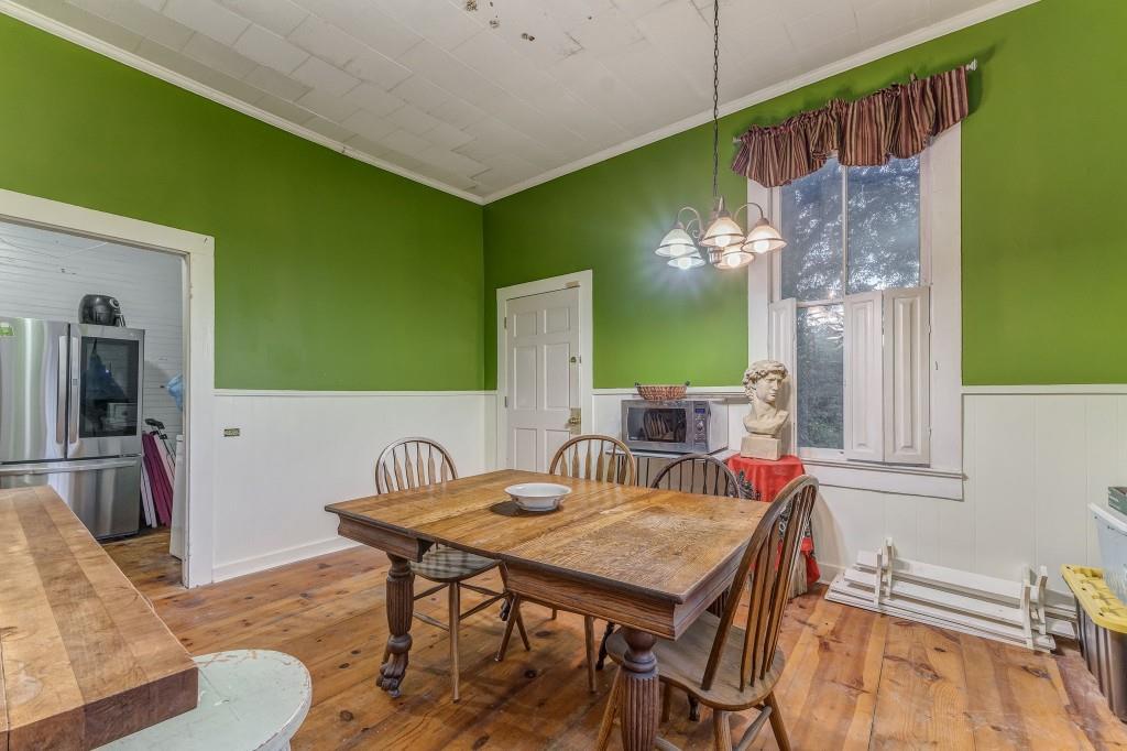 1006 Avenue A Rome, GA 30165 - Photo 32 of 61 a view of a dining room with furniture and a chandelier