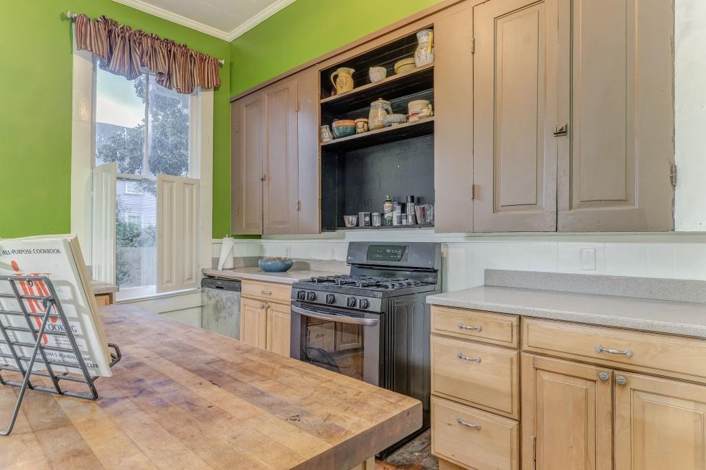 1006 Avenue A Rome, GA 30165 - Photo 35 of 61 a kitchen with stainless steel appliances a stove and a cabinets