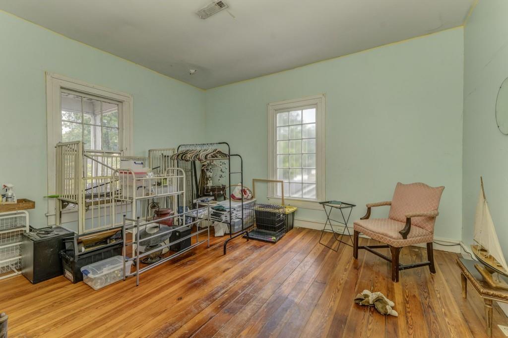 1006 Avenue A Rome, GA 30165 - Photo 38 of 61 a living room with furniture a window and wooden floor