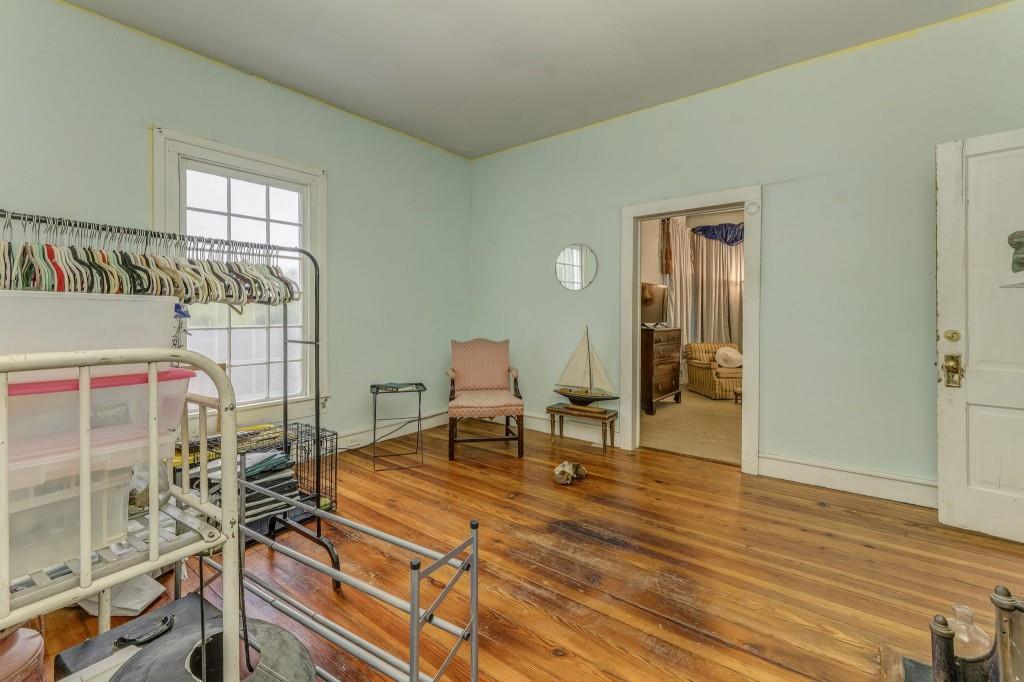 1006 Avenue A Rome, GA 30165 - Photo 40 of 61 a living room with furniture a wooden floor and next to a window