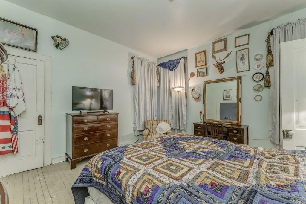 1006 Avenue A Rome, GA 30165 - Photo 41 of 61 a bedroom with a bed and flat screen tv