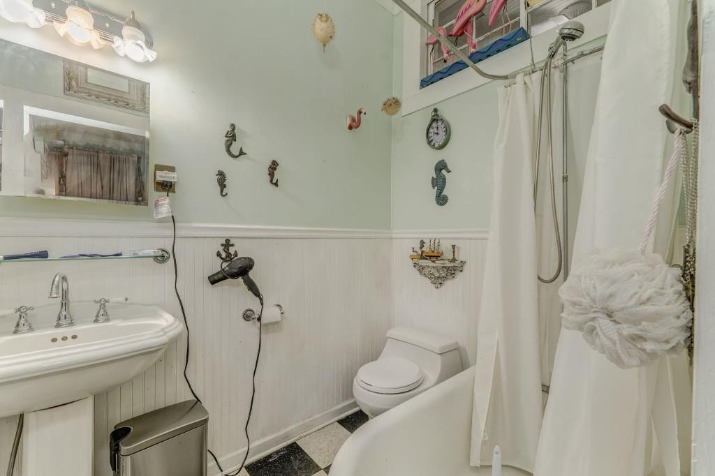 1006 Avenue A Rome, GA 30165 - Photo 44 of 61 a bathroom with a sink a toilet and shower