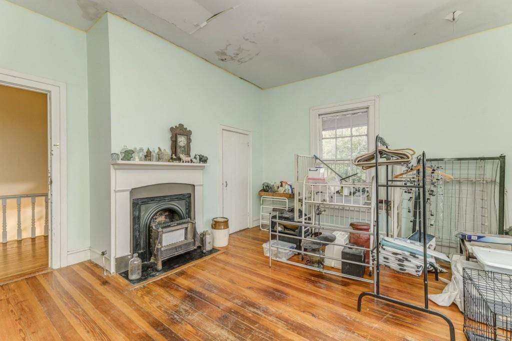 1006 Avenue A Rome, GA 30165 - Photo 46 of 61 a living room with furniture and a fireplace