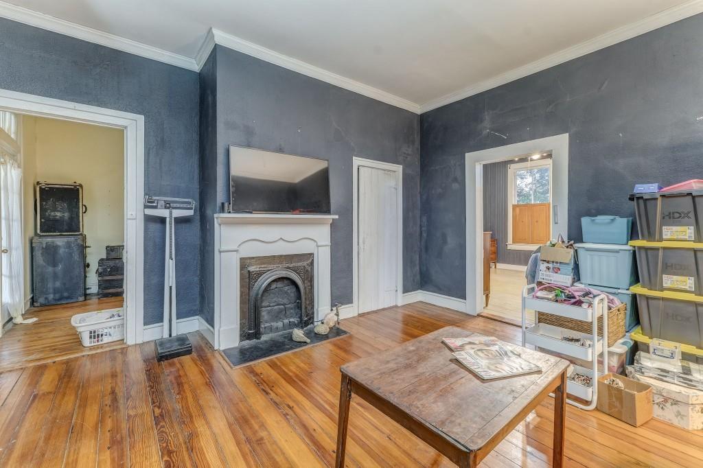 1006 Avenue A Rome, GA 30165 - Photo 48 of 61 a living room with furniture and a fireplace
