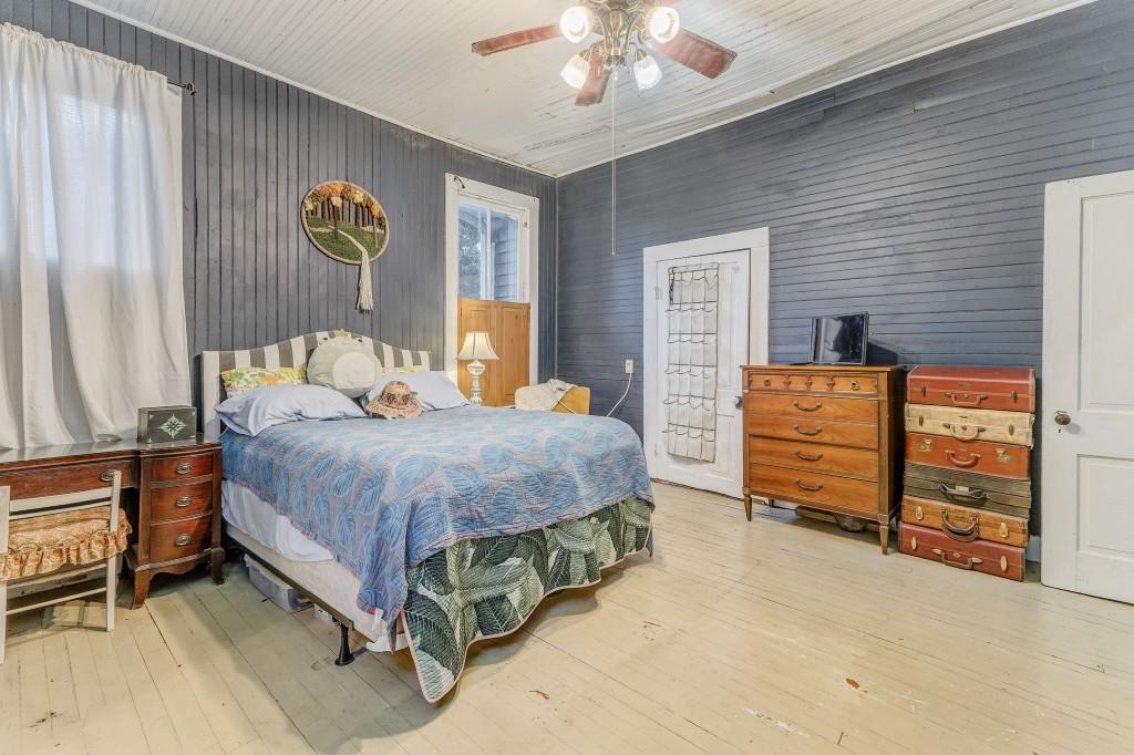 1006 Avenue A Rome, GA 30165 - Photo 52 of 61 a bedroom with a bed and a chandelier