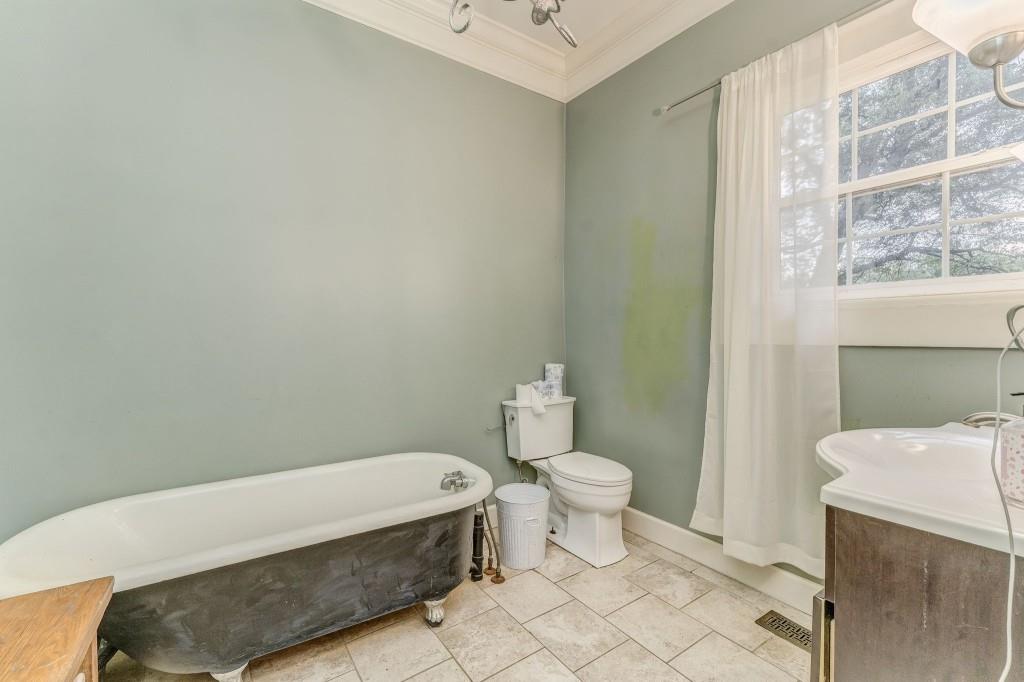 1006 Avenue A Rome, GA 30165 - Photo 54 of 61 a bathroom with a sink a toilet and a mirror
